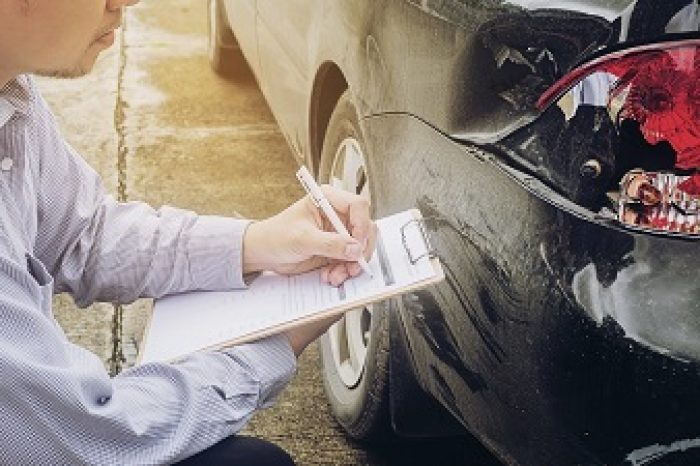 Insurance agent working on car accident claim process