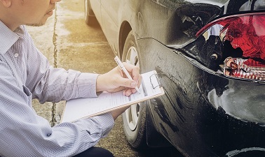 Insurance agent working on car accident claim process